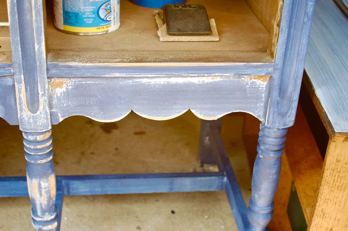 how to use milkpaint to distress an old thrifted sideboard.