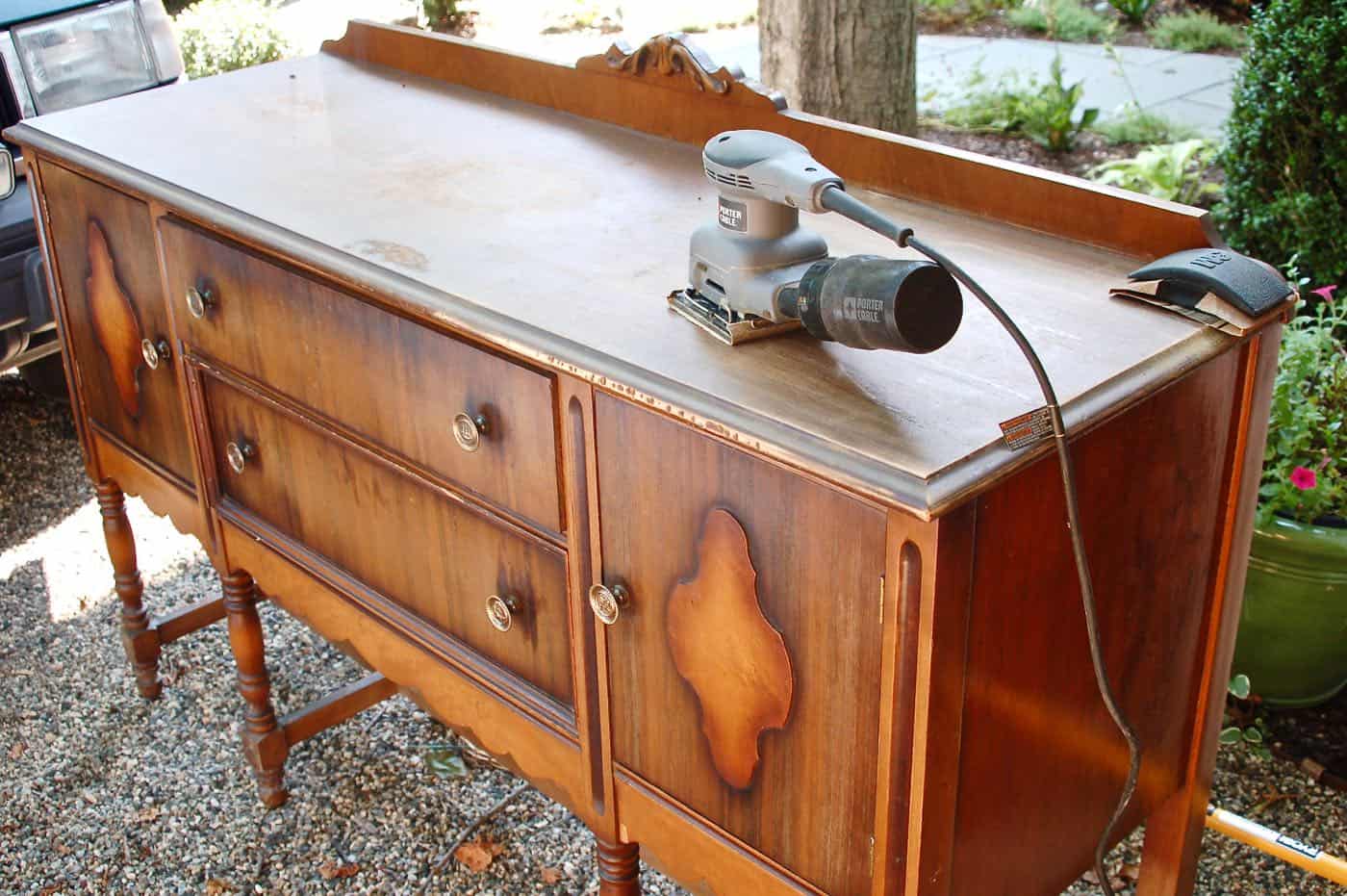 how to use milkpaint to distress an old thrifted sideboard.