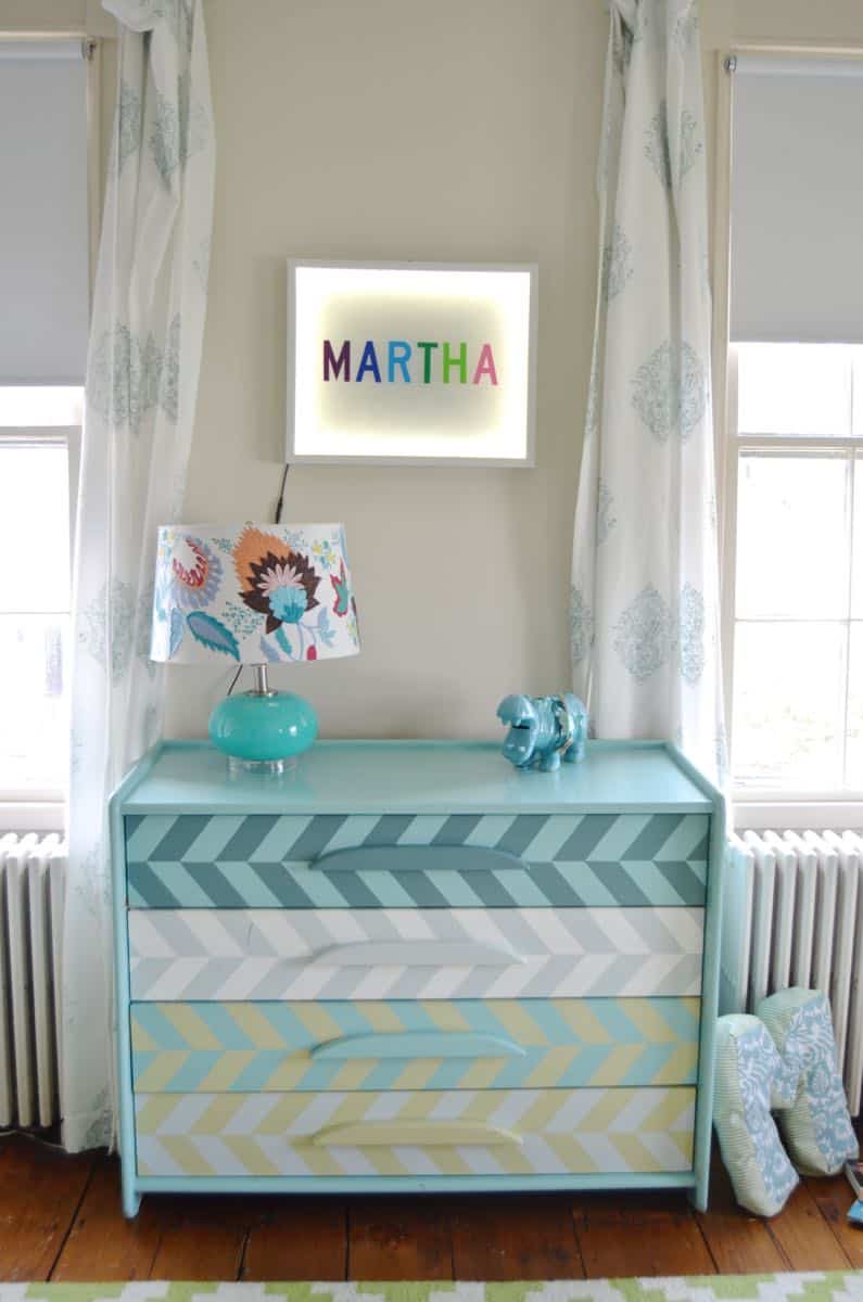 Colorful striped repainted Craigslist dresser