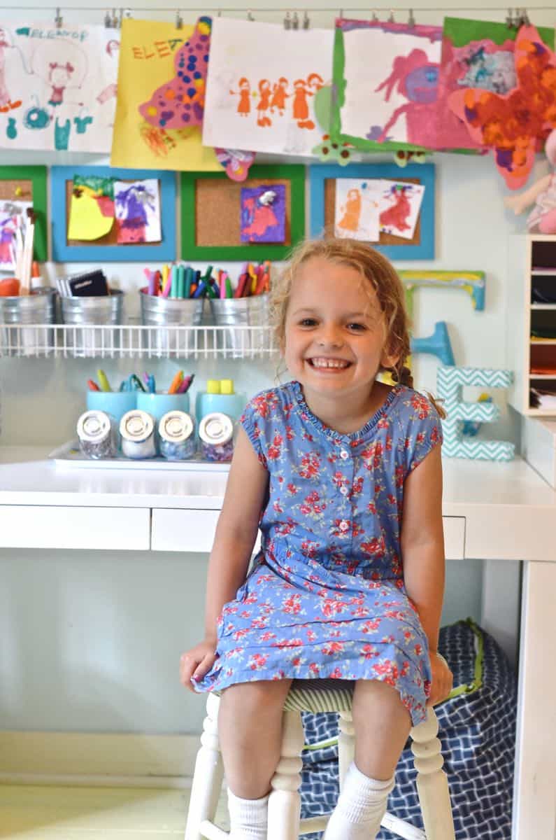 little girl sitting at art center