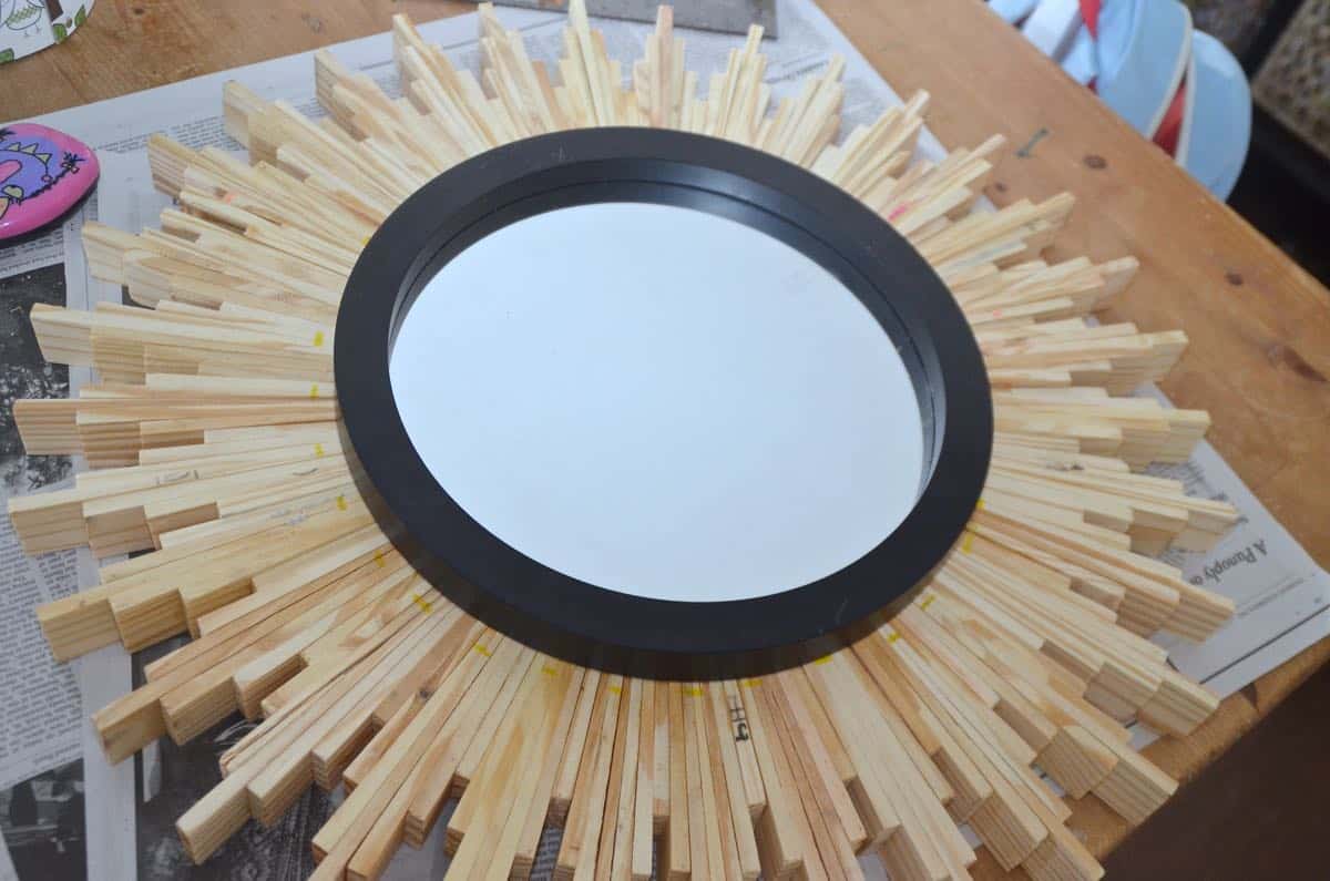 How to create a DIY sunburst mirror out of wood shims.