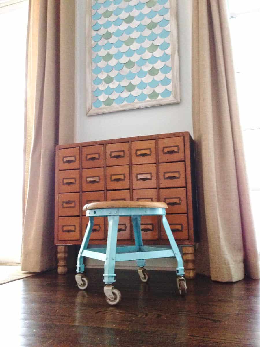 this old metal industrial stool got a makeover with a fresh coat of paint.