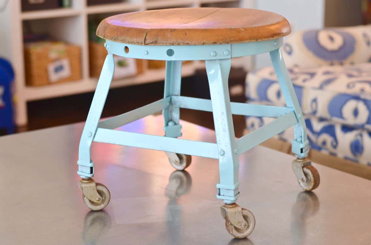 this old metal industrial stool got a makeover with a fresh coat of paint.