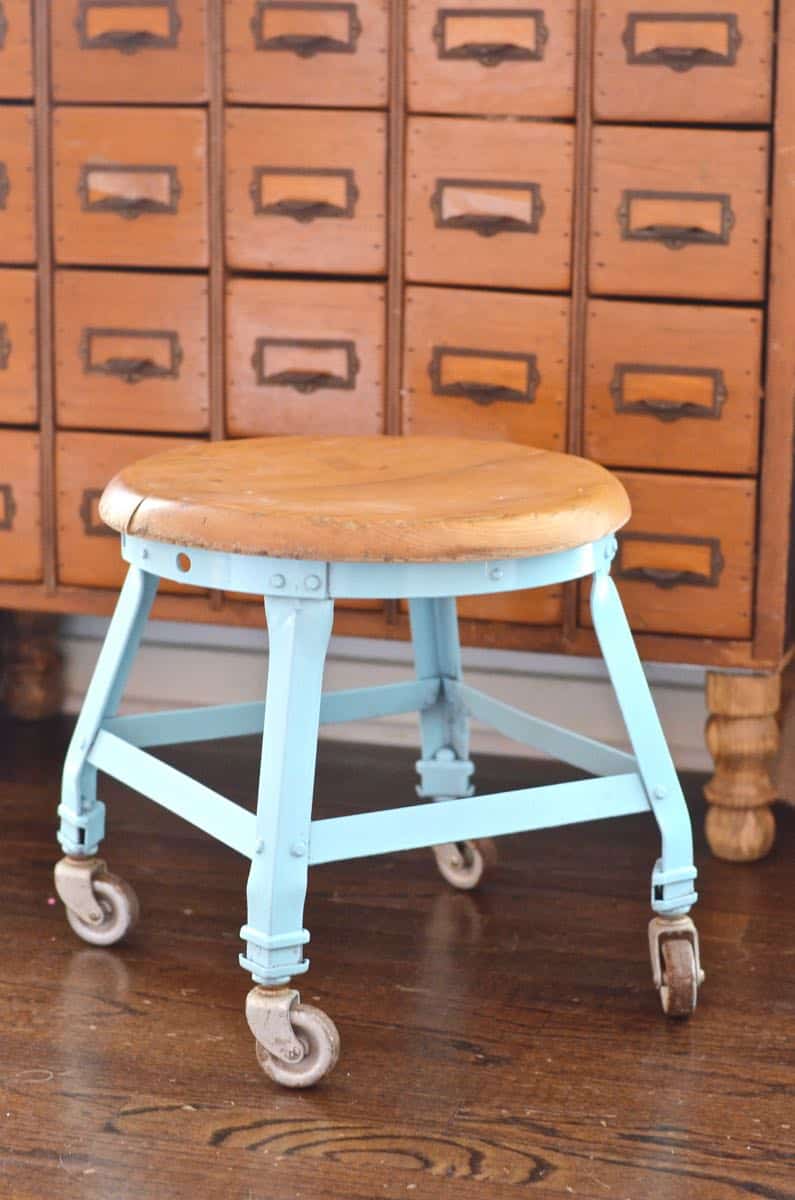 this old metal industrial stool got a makeover with a fresh coat of paint.