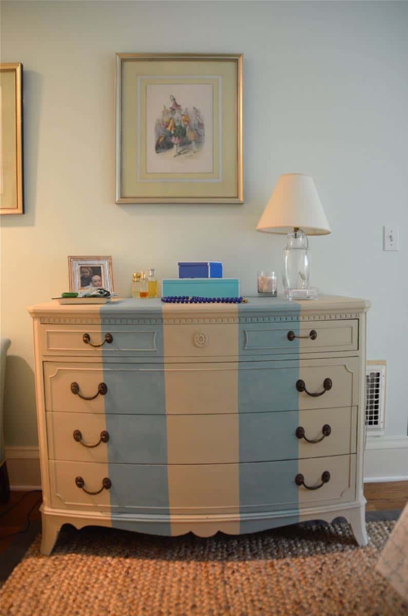 Old bureau gets a fresh look and is now a colorful striped dresser for the master bedroom. 