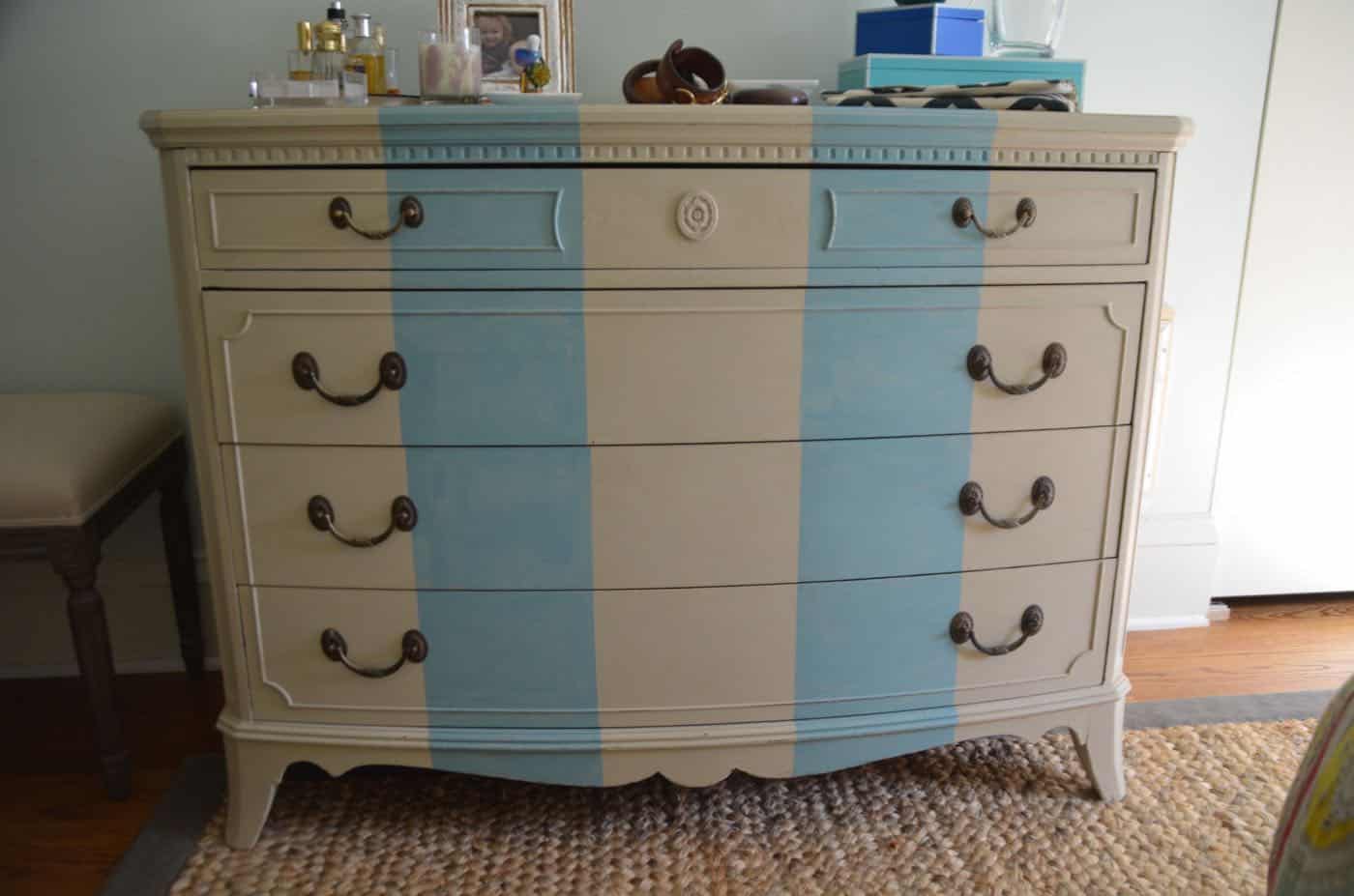 Old bureau gets a fresh look and is now a colorful striped dresser for the master bedroom. 