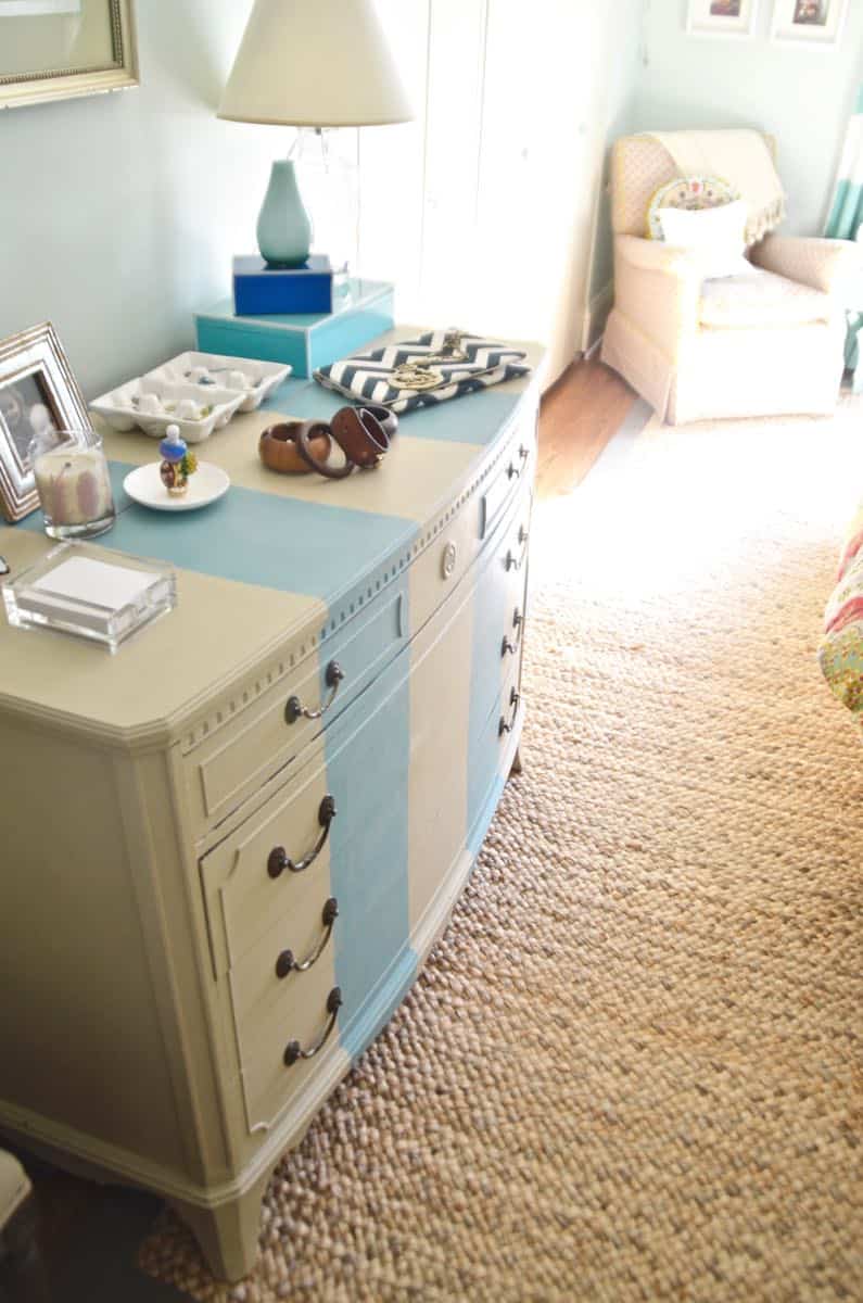 Old bureau gets a fresh look and is now a colorful striped dresser for the master bedroom. 