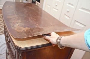Old bureau gets a fresh look and is now a colorful striped dresser for the master bedroom.