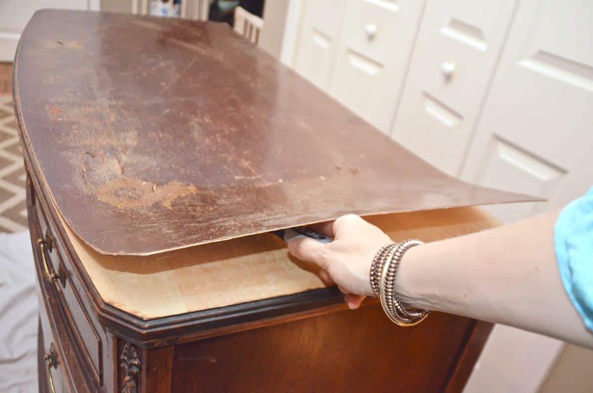 Old bureau gets a fresh look and is now a colorful striped dresser for the master bedroom. 