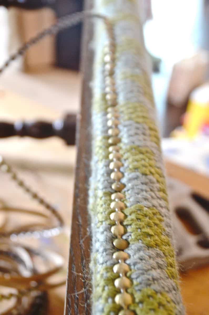 Upholstering a plain bench with a throw rug.