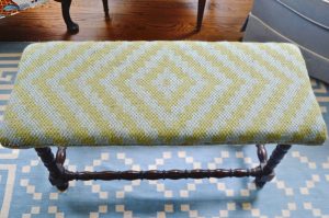 Upholstering a plain bench with a throw rug.