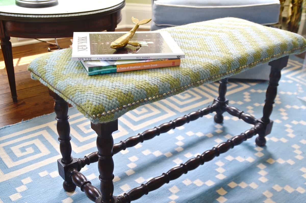 Upholstering a plain bench with a throw rug.