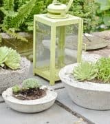 Save lots of money by making your own chic and modern concrete planters with this easy tutorial.