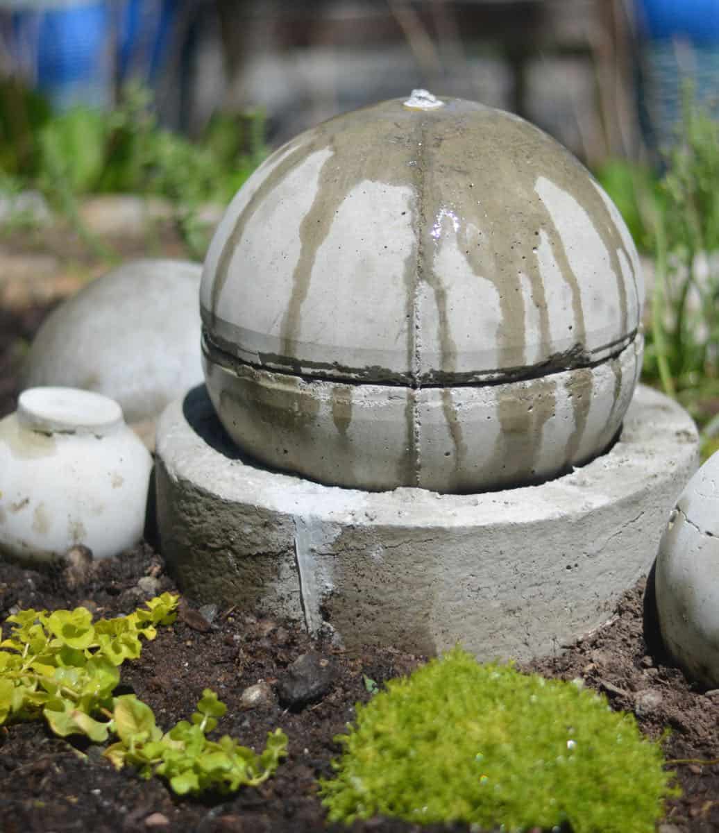 Make a bubbling concrete orb backyard fountain.