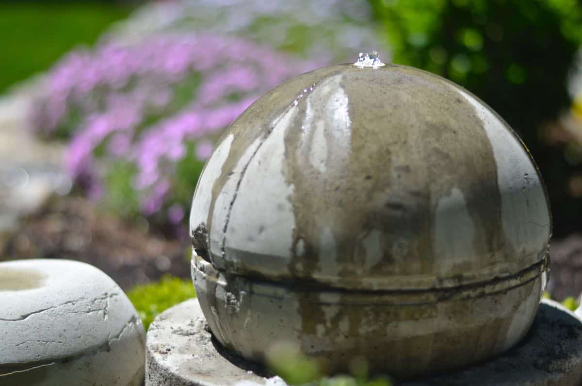 Make a bubbling concrete orb backyard fountain.