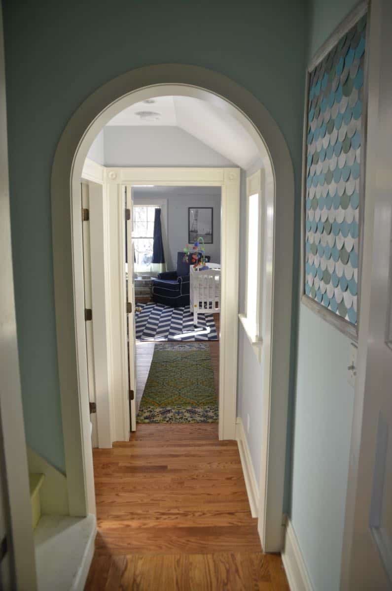 Mixing pattern and flea market treasures in our navy blue guest room.