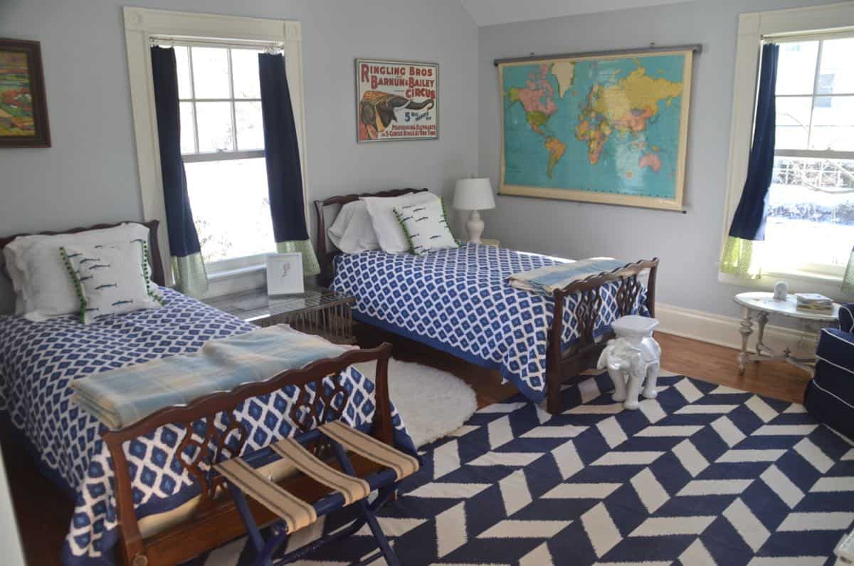 Mixing pattern and flea market treasures in our navy blue guest room.