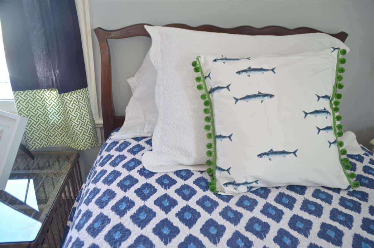 Mixing pattern and flea market treasures in our navy blue guest room.