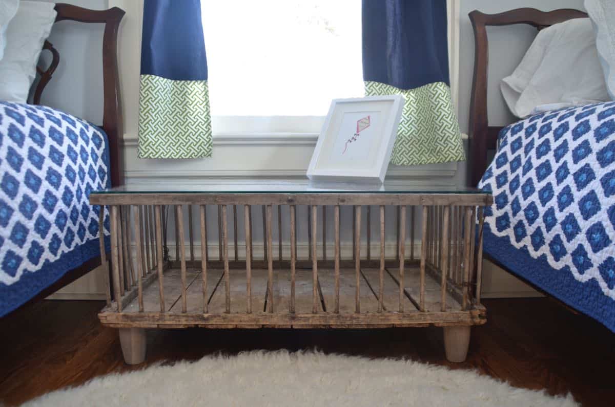 Mixing pattern and flea market treasures in our navy blue guest room.