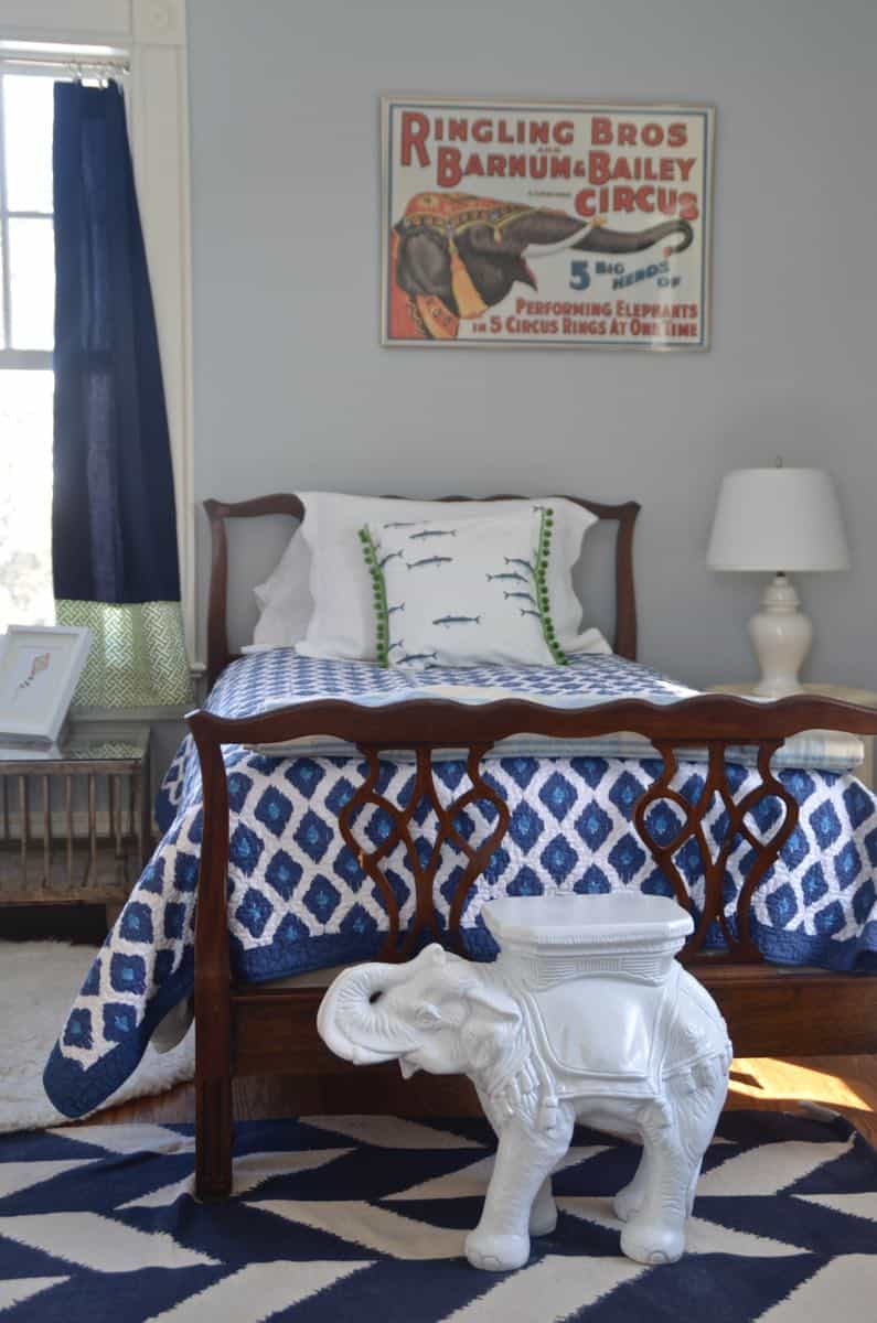 Mixing pattern and flea market treasures in our navy blue guest room.