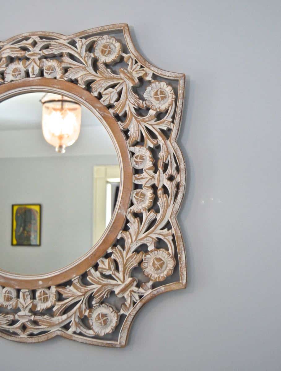 Mixing pattern and flea market treasures in our navy blue guest room.