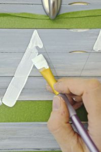 Reuse those free painters mixing sticks and give a boring piece of laminate furniture a total makeover.