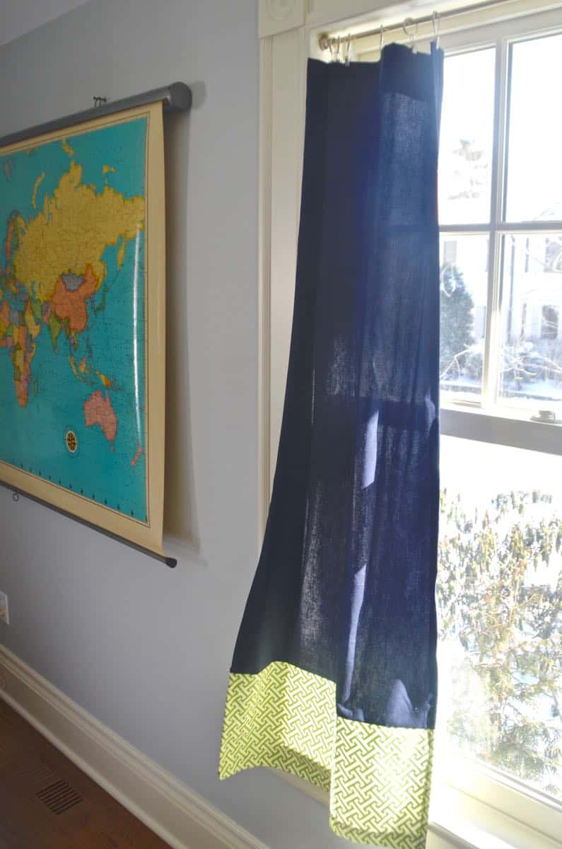 Mixing pattern and flea market treasures in our navy blue guest room.