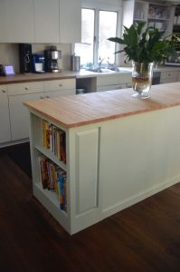 Thrifted kitchen cabinet is put to use as a functional new kitchen island.