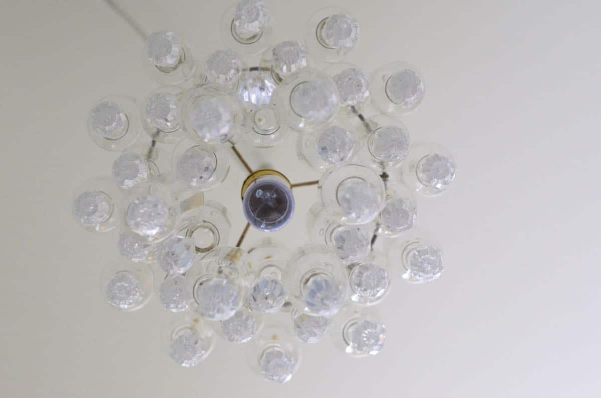 These plastic dollar store bottles were transformed into a fun and decorative chandelier