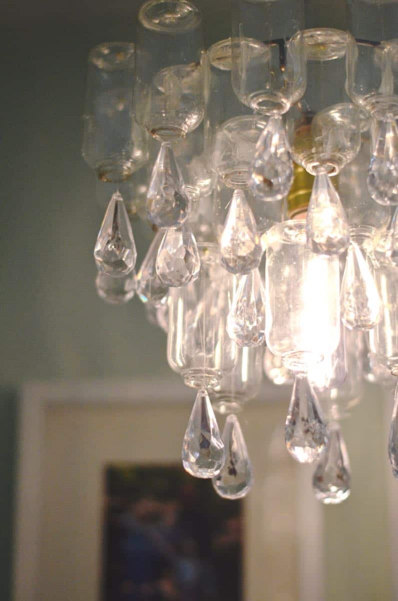 These plastic dollar store bottles were transformed into a fun and decorative chandelier