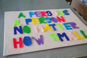 lay out felt letters on canvas backing