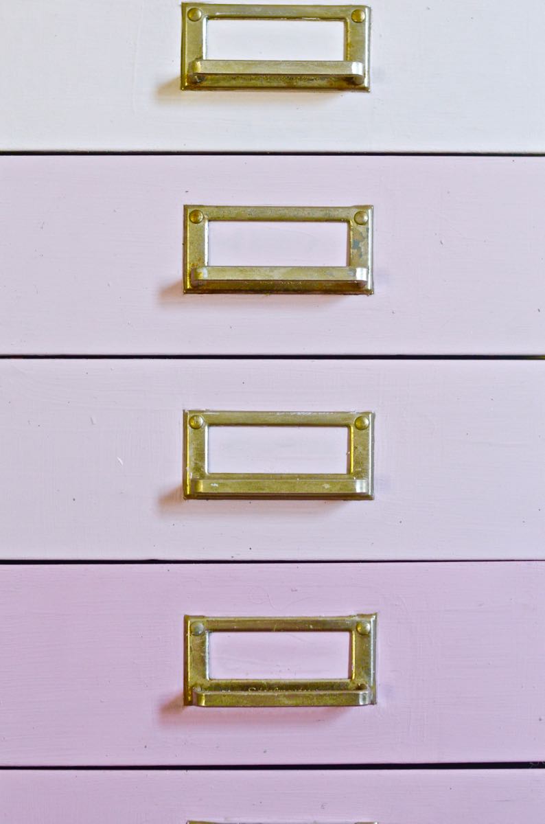 A plain industrial file cabinet is transformed thanks to an ombre paint treatment and a new DIY base.