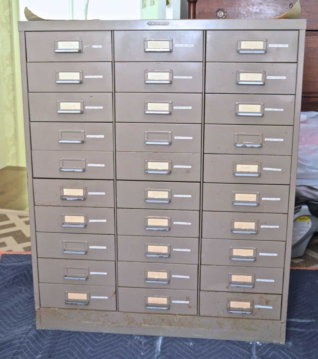 A plain industrial file cabinet is transformed thanks to an ombre paint treatment and a new DIY base.