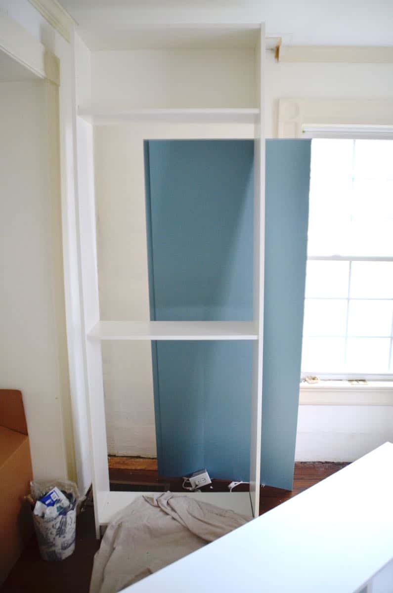 Transforming Ikea billy bookshelves into upscale looking built in shelving.