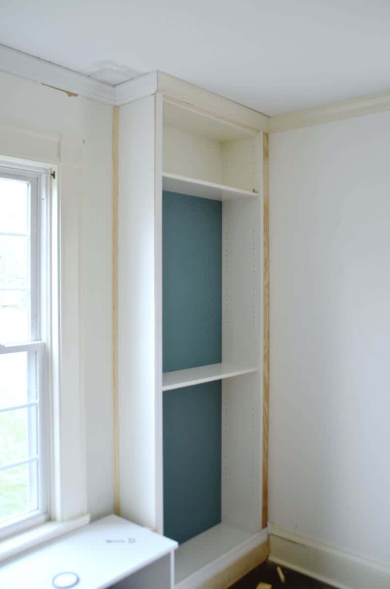 Transforming Ikea billy bookshelves into upscale looking built in shelving.