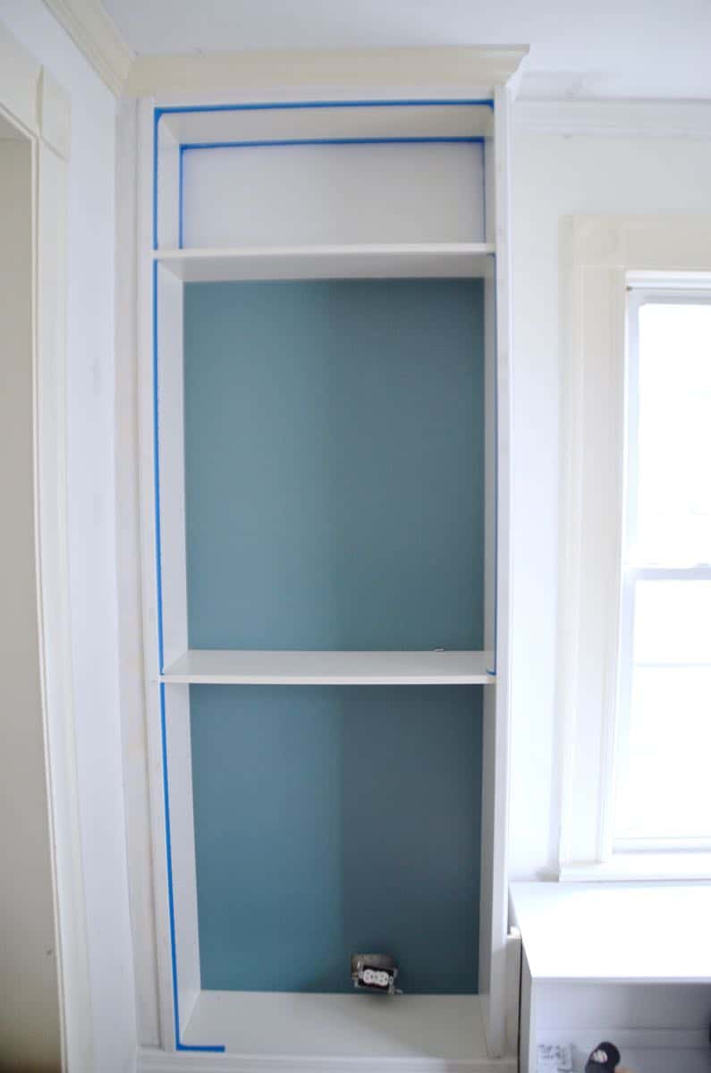 Transforming Ikea billy bookshelves into upscale looking built in shelving.