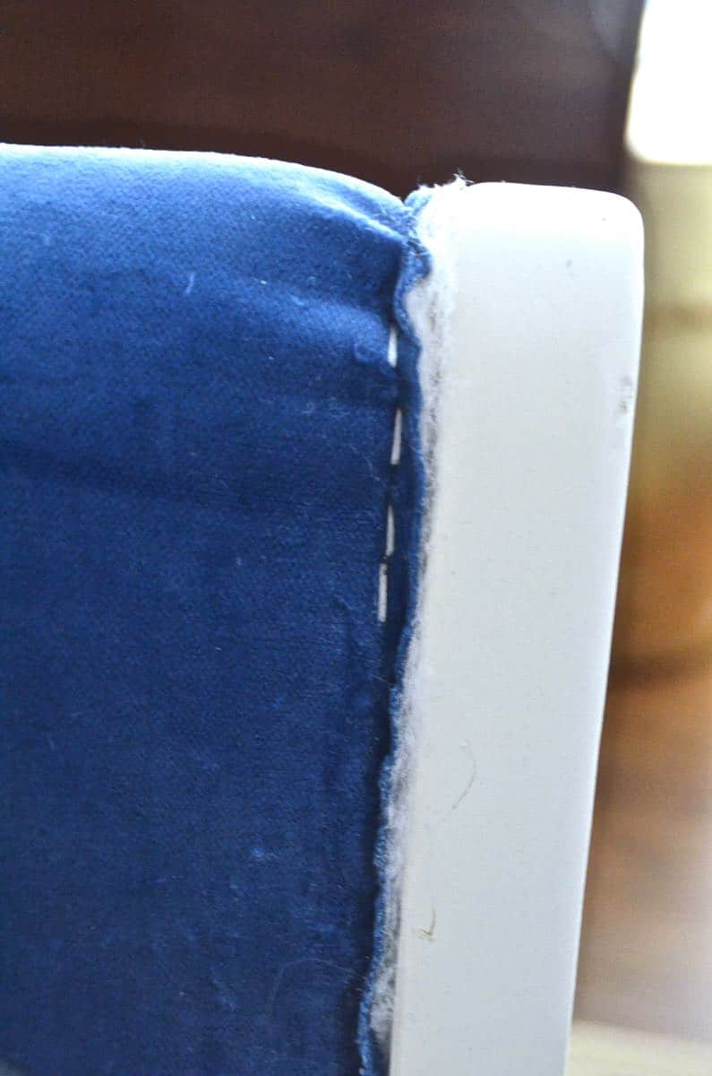 Turn a wooden bench into an upholstered loveseat.