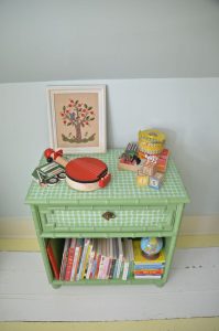 Easy way to upcycle and refinish furniture with fabric.