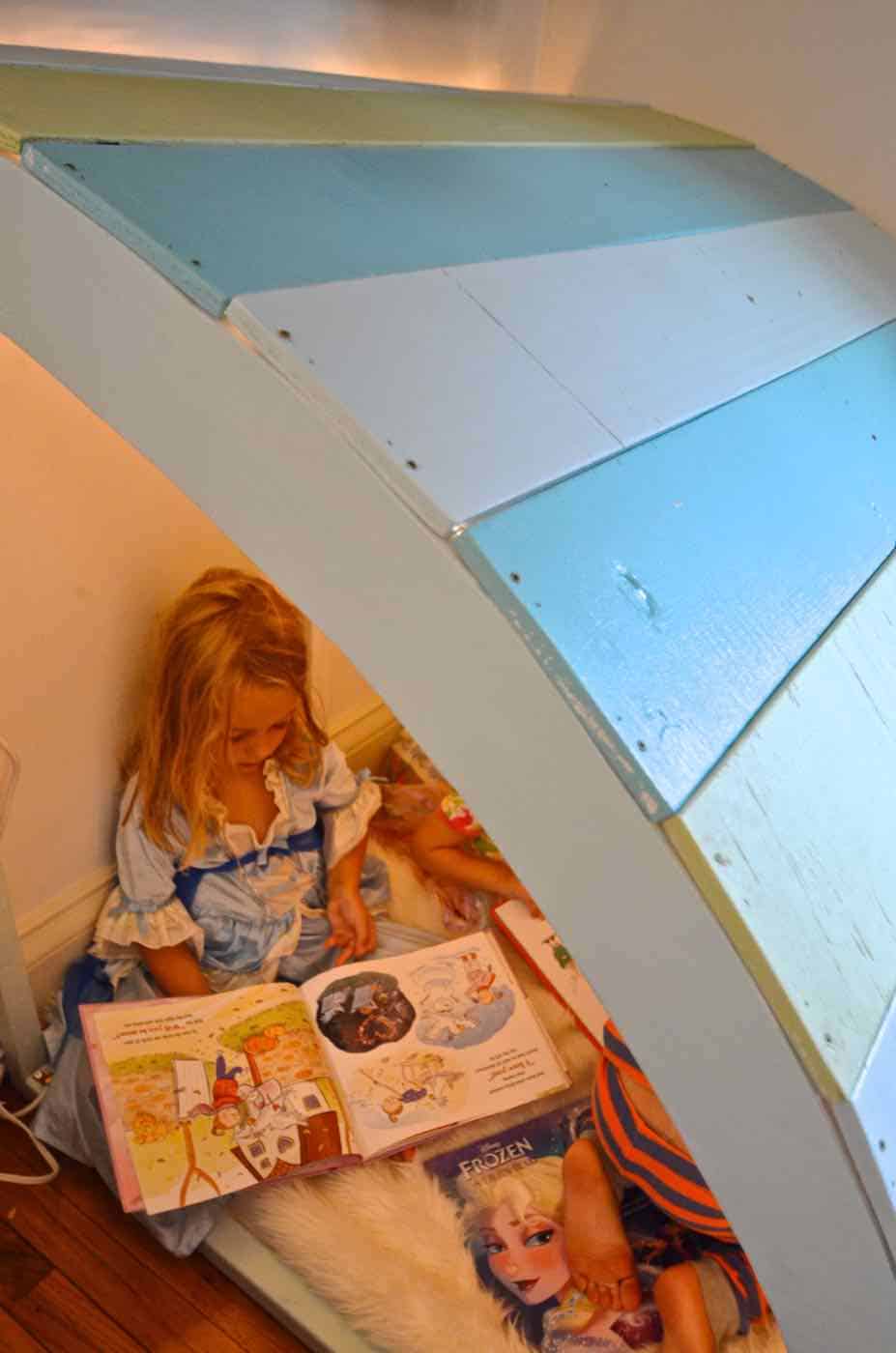 Simple and inexpensive corner reading nook using plywood and paint.