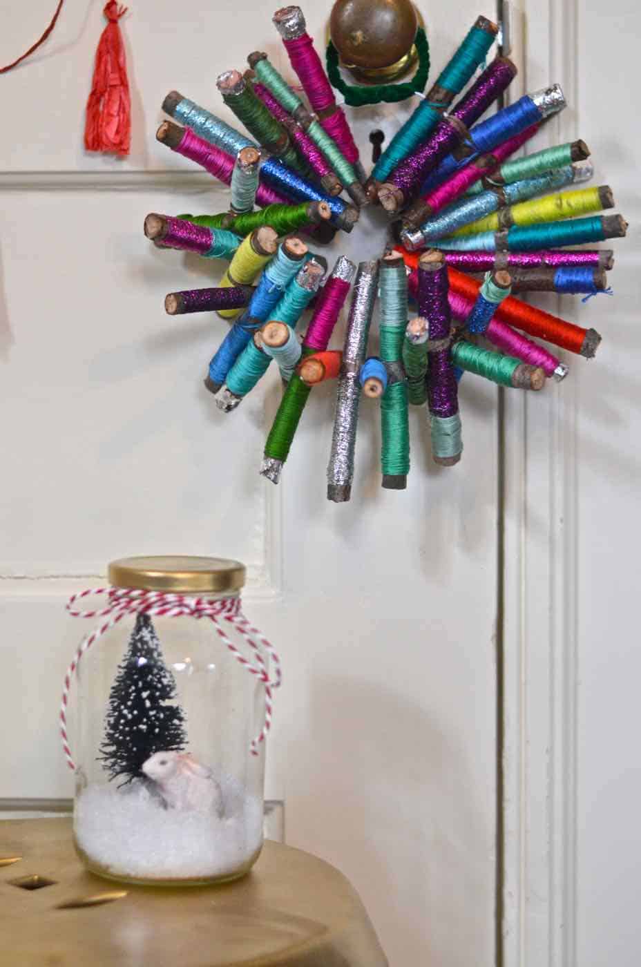 Sticks and thread transformed into this colorful rustic wreath.