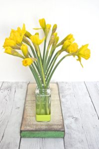 Thrift store glassware is made into this cute bud vase centerpiece.