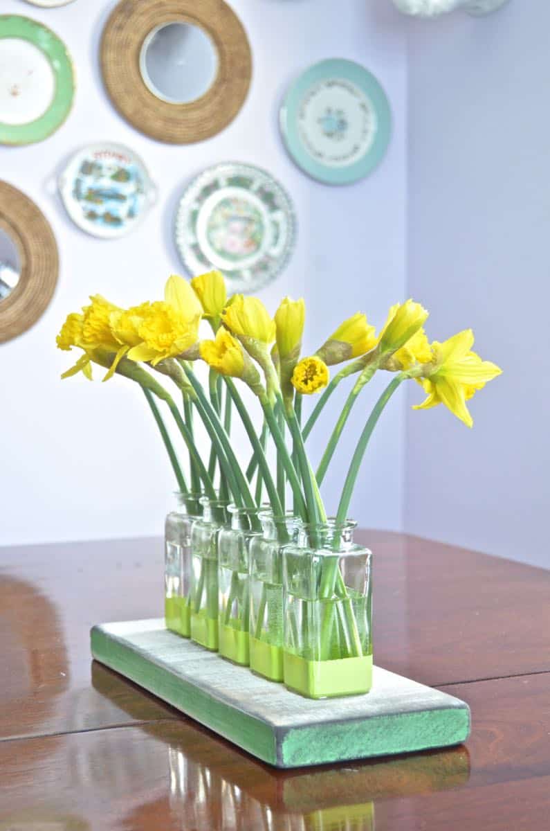 Thrift store glassware is made into this cute bud vase centerpiece.