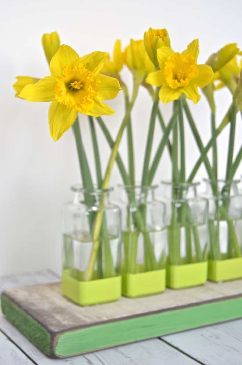 Thrift store glassware is made into this cute bud vase centerpiece.