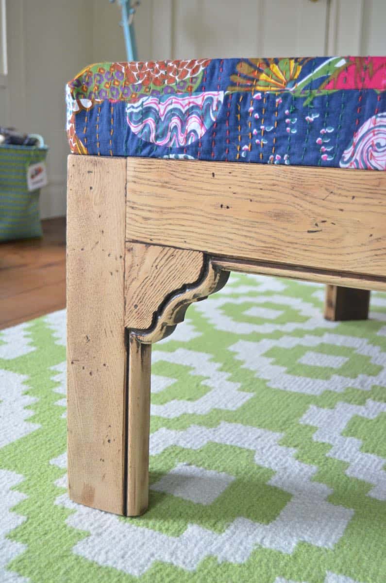 Turn a basic coffee table into an upholstered ottoman.