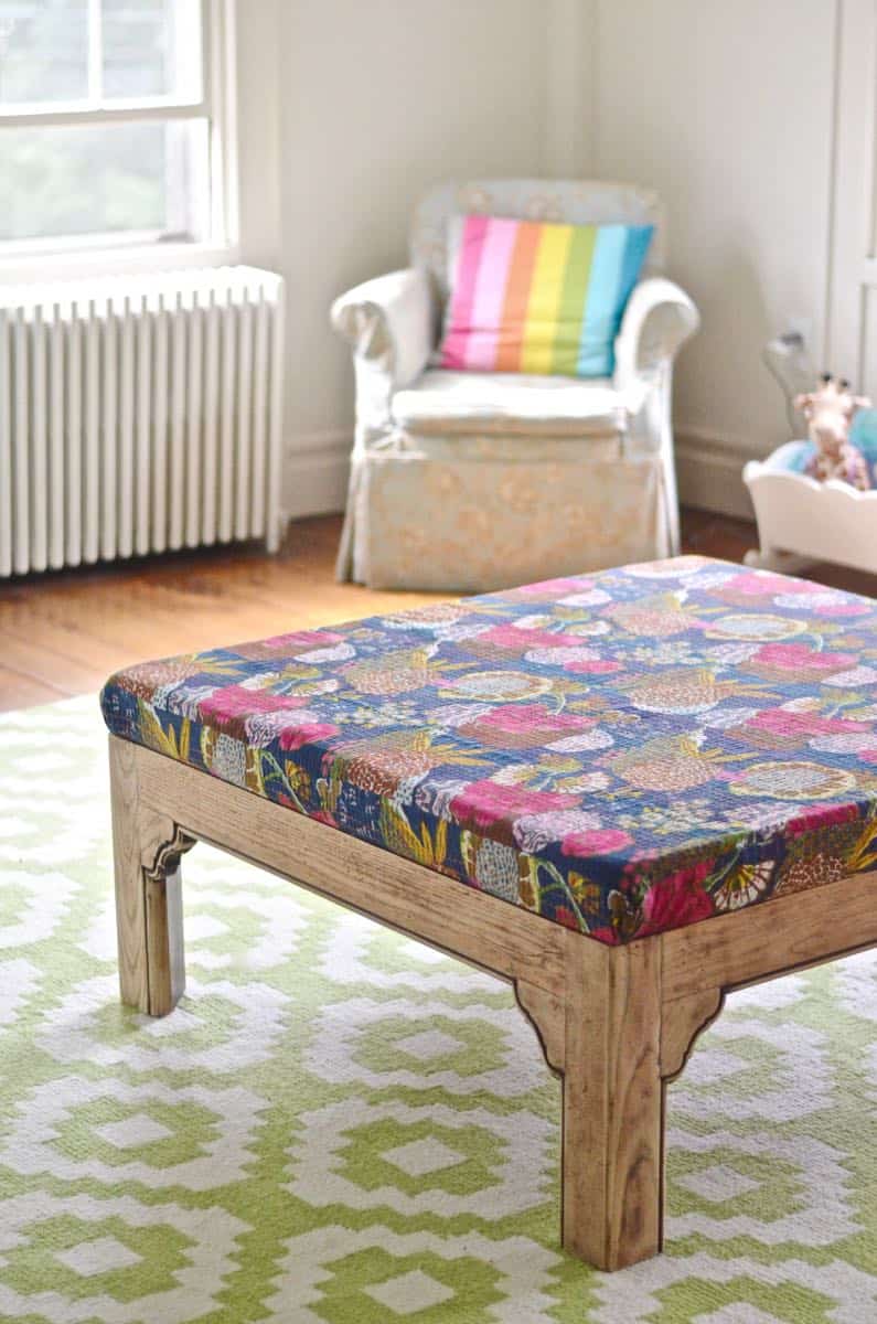 Turn a basic coffee table into an upholstered ottoman.