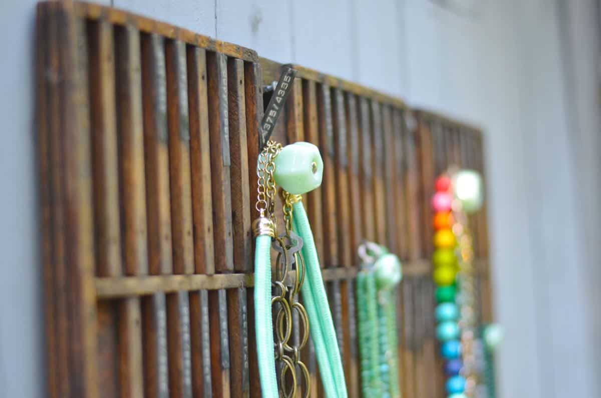 Decorative knobs turned into simple and chic jewelry storage.