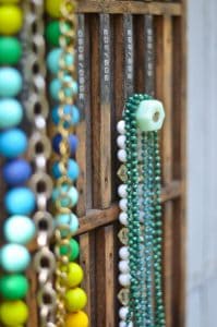 Decorative knobs turned into simple and chic jewelry storage.