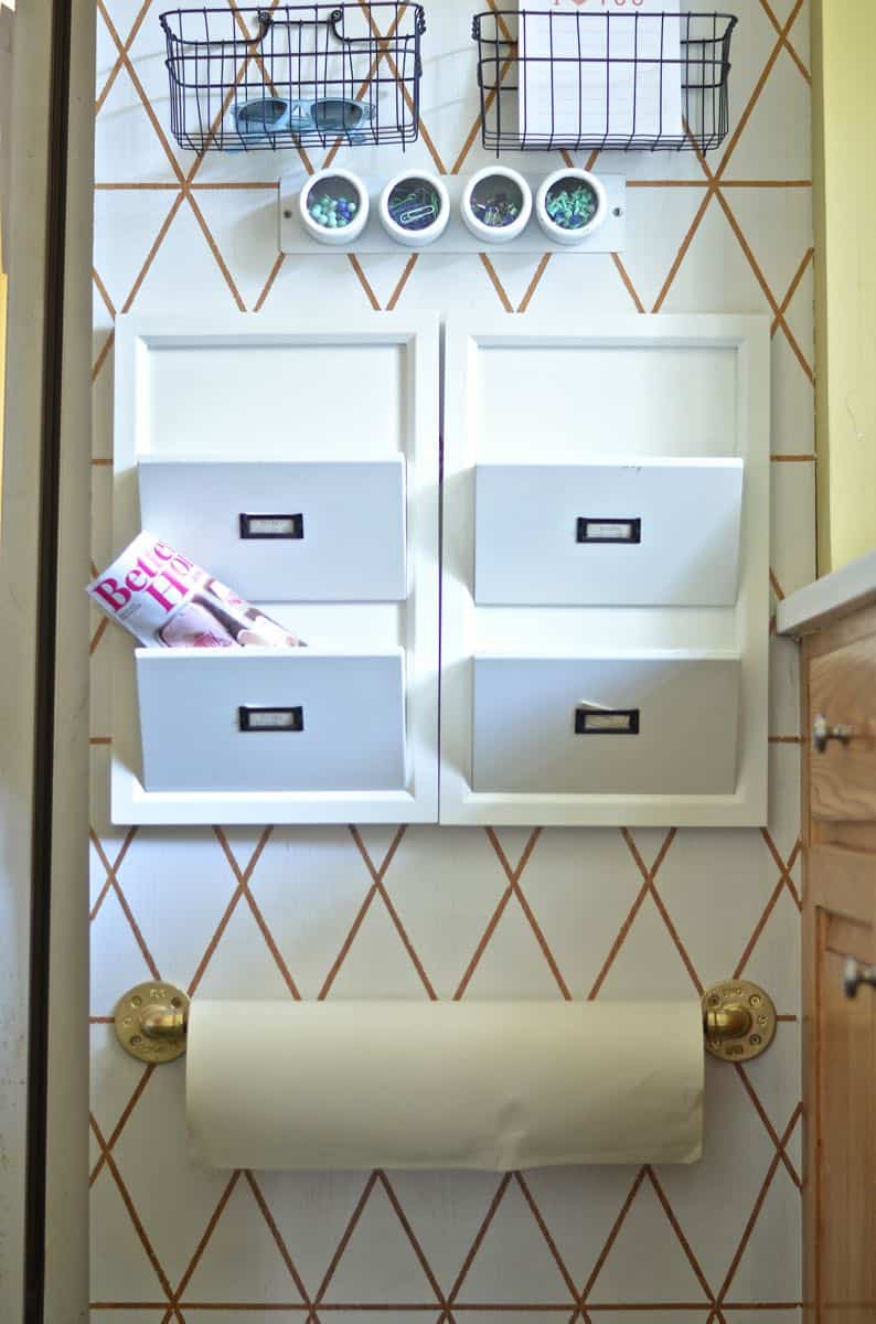 Organize your family with this creative use of one small kitchen wall.