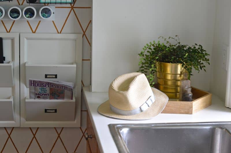 Organize your family with this creative use of one small kitchen wall.