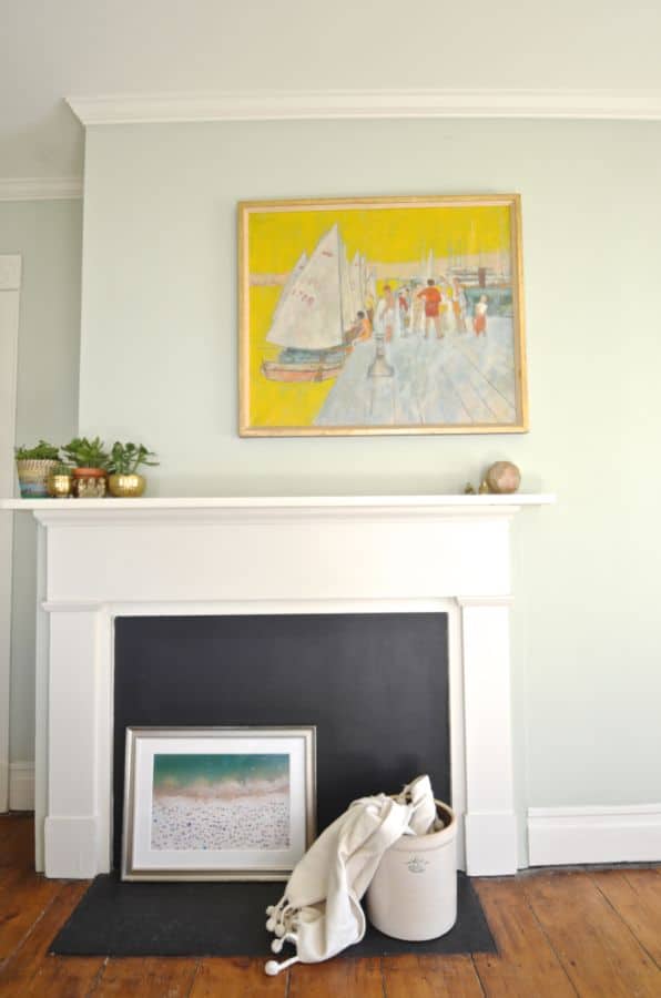 fireplace with colorful painting